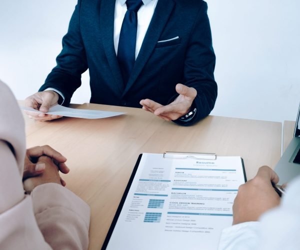 Business situation, job interview concept. Job seeker present resume to managers.